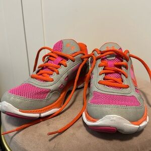 Under Armour, back-to-school kids running shoes. Hot pink and orange in size 3.